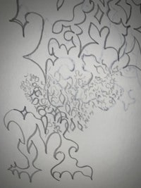 a drawing of a flower and leaves on a piece of paper